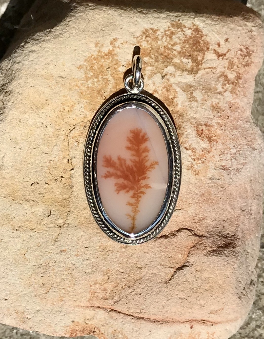 Silver pendant with dendritic agate
